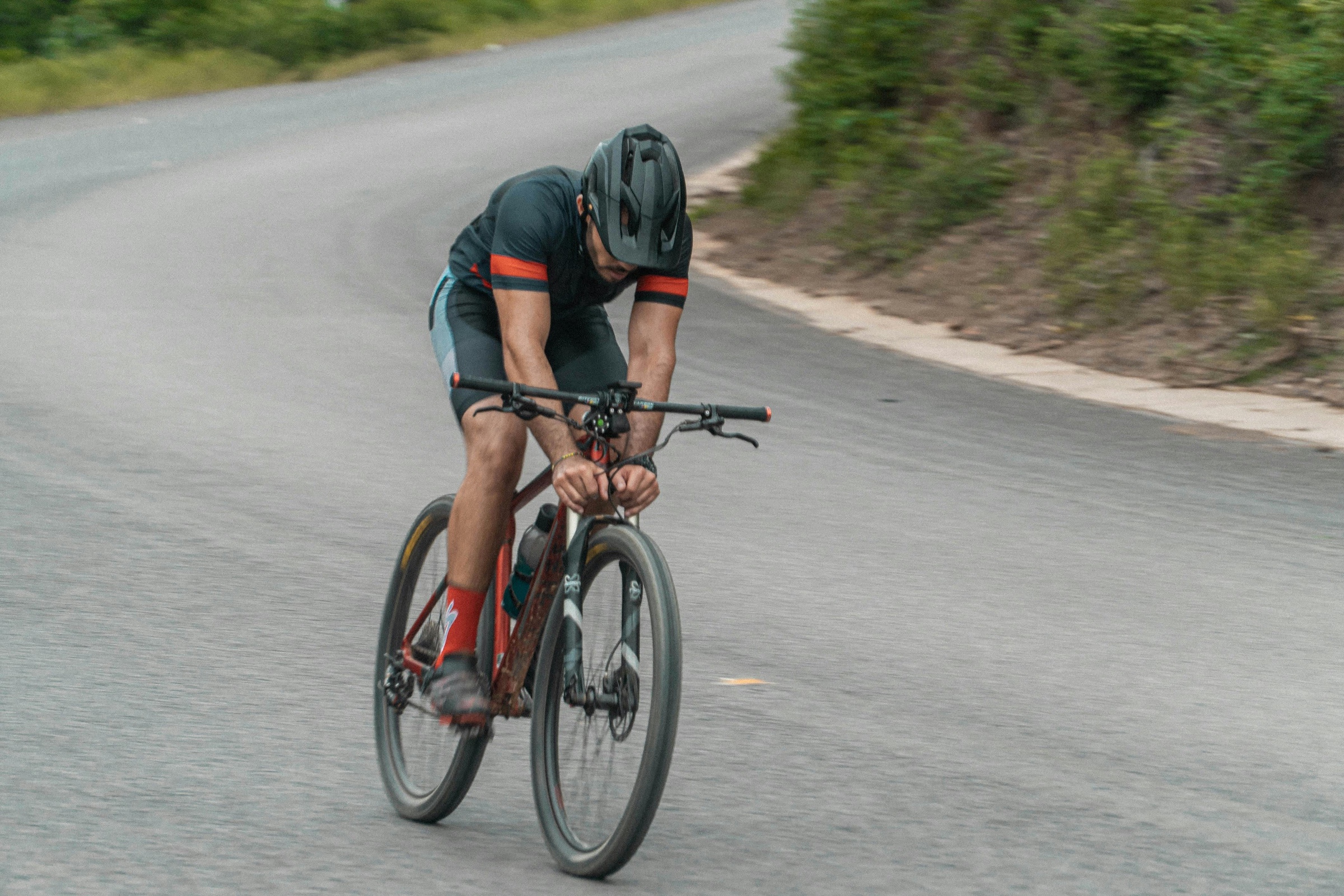 Cyclist Riding curve of downhill ride for cycling training plan