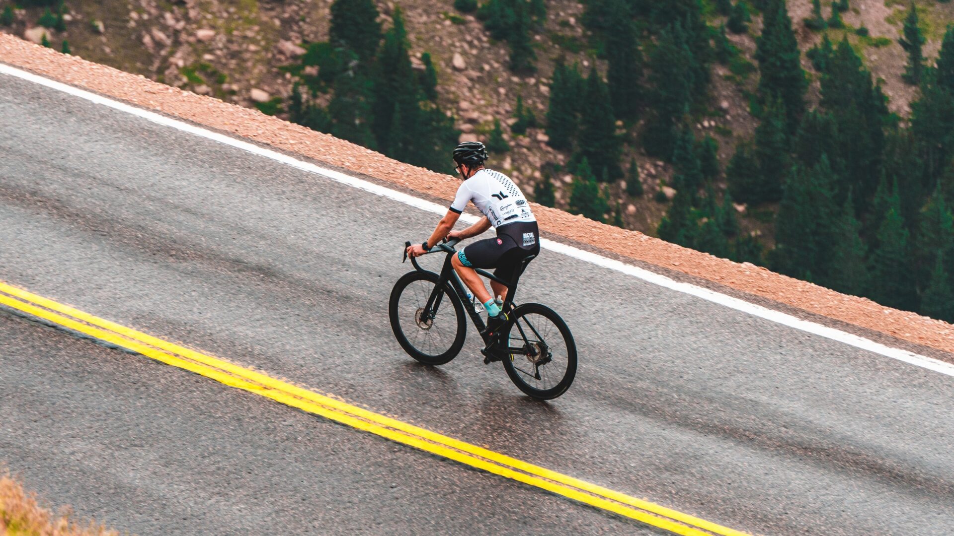 Cyclist climbing a mountain road