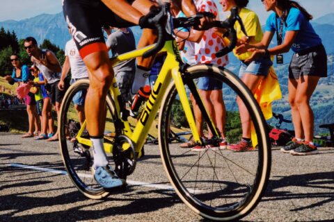 Pro cyclist getting cheered on near finish line