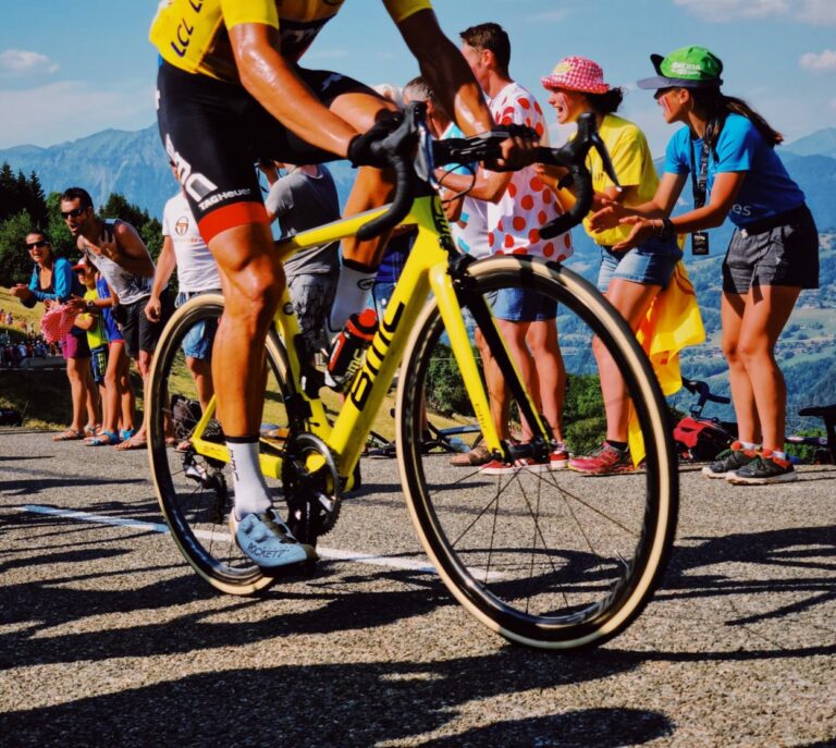 Pro cyclist getting cheered on near finish line
