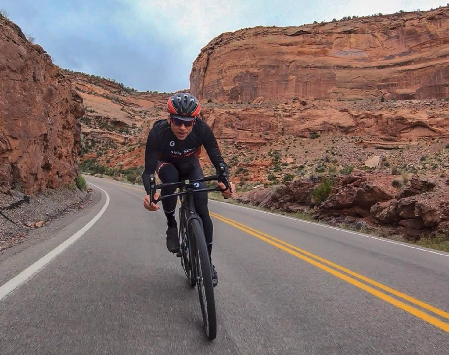 Chris Case pedaling a bike through a canyon