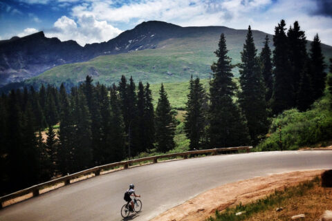 cyclist climbing by bike on Guanella Pass Colorado