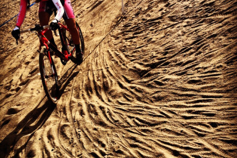 Racing cyclocross through the sand.