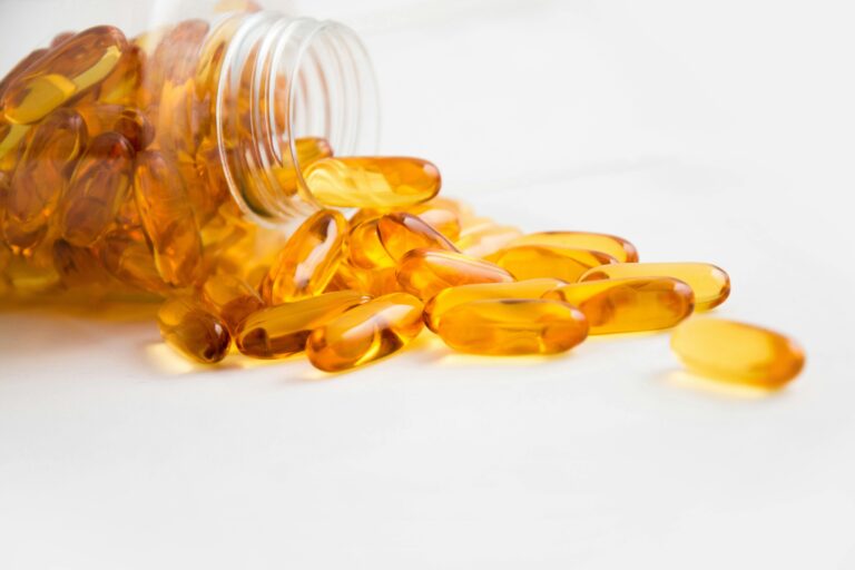 Yellow capsules on table for athletic supplement responsibility