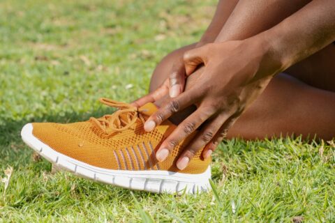 athlete holding ankle