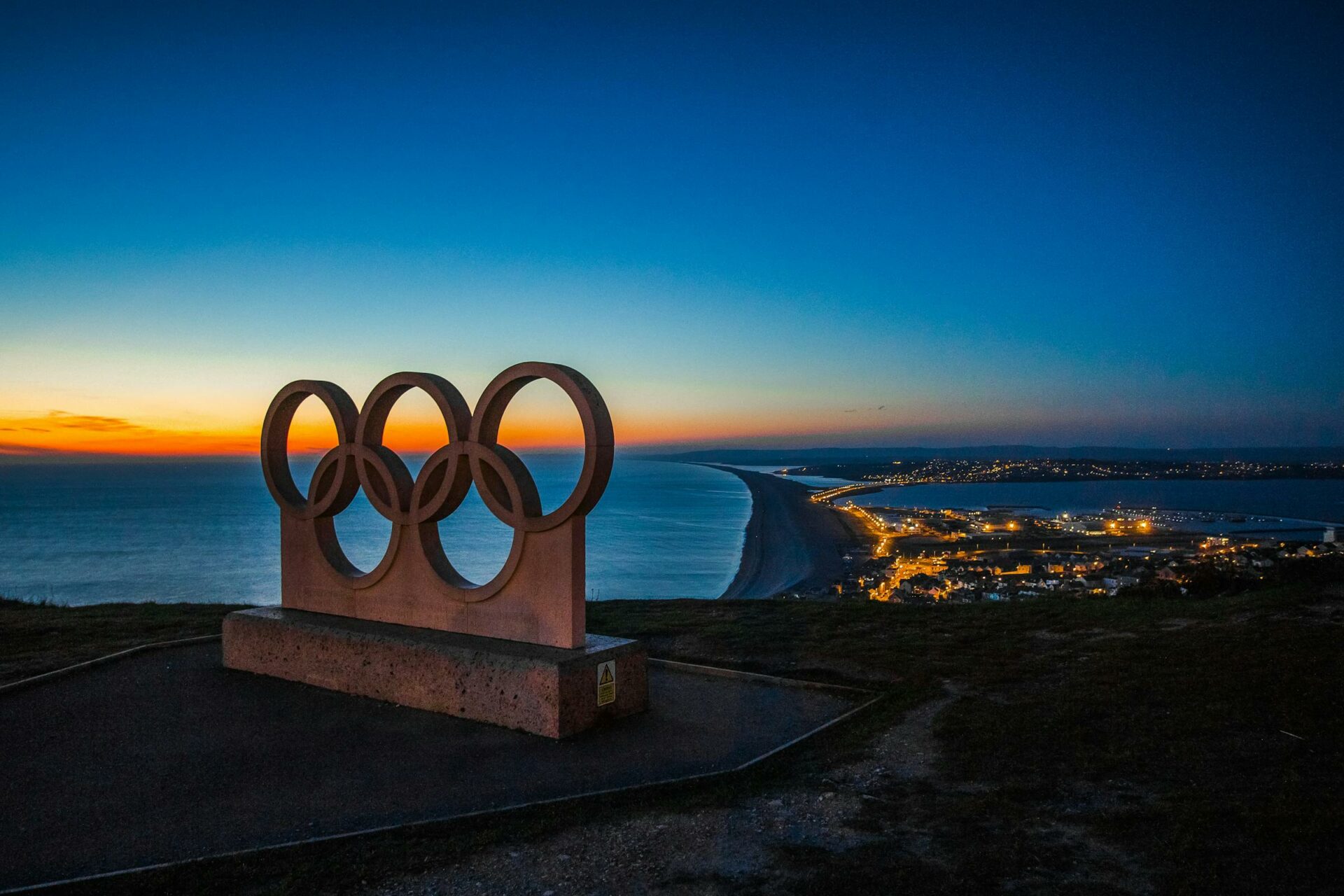 Olympic rings before a sunset