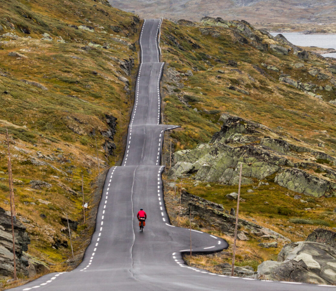 Cyclist on mountain road in Norway