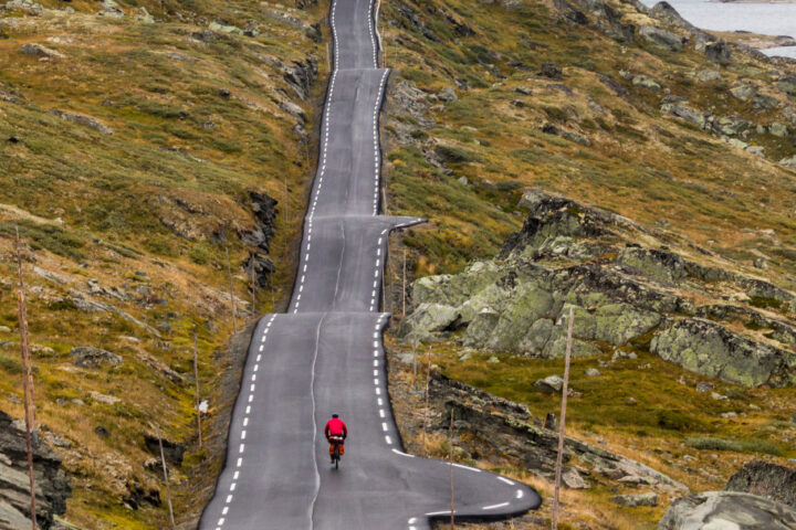 Cyclist on mountain road in Norway