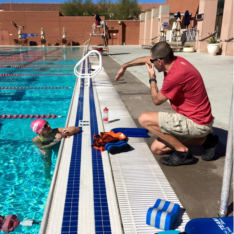 Coach Alan Couzens teaches a swimmer