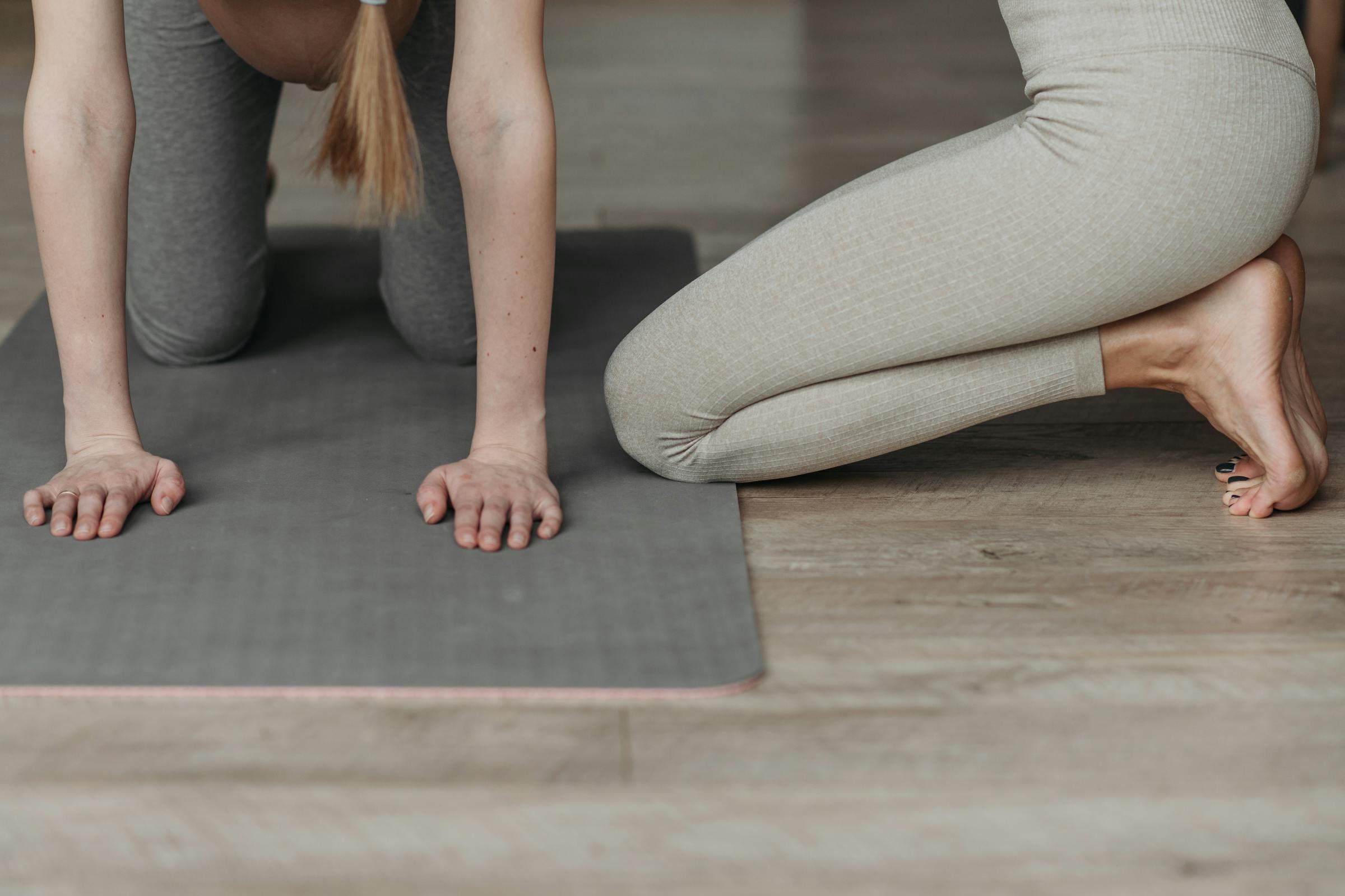 coach with a yoga student