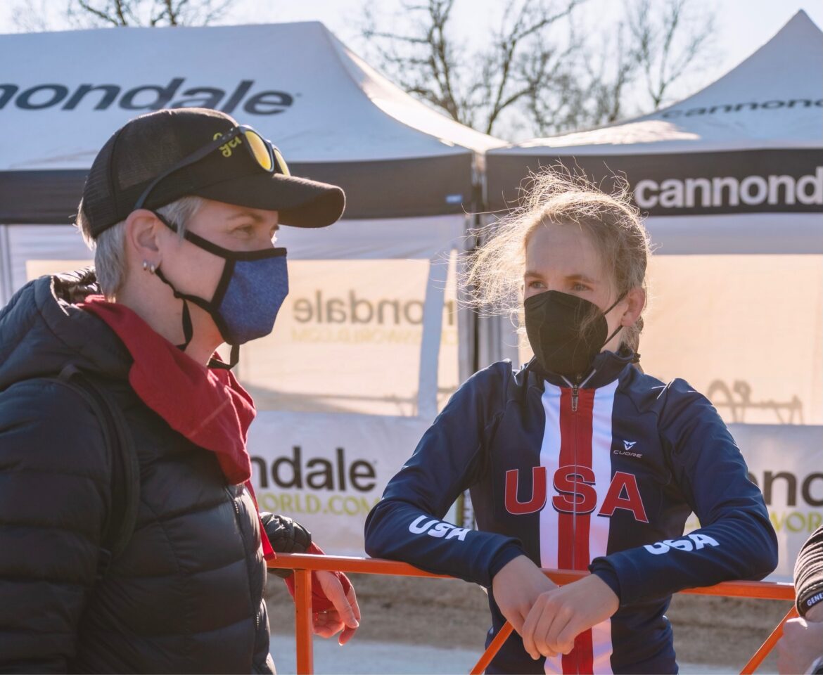 Coach Kendra Wenzel consulting with her athlete at Cyclocross world championships