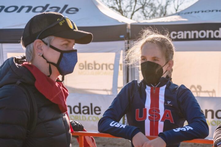 Coach Kendra Wenzel consulting with her athlete at Cyclocross world championships