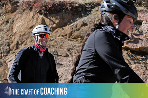photo of a coach and cyclist