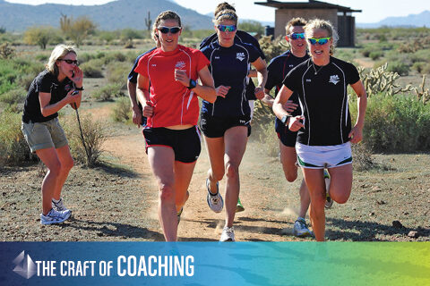 photo of a coach working with USA Triathlon team