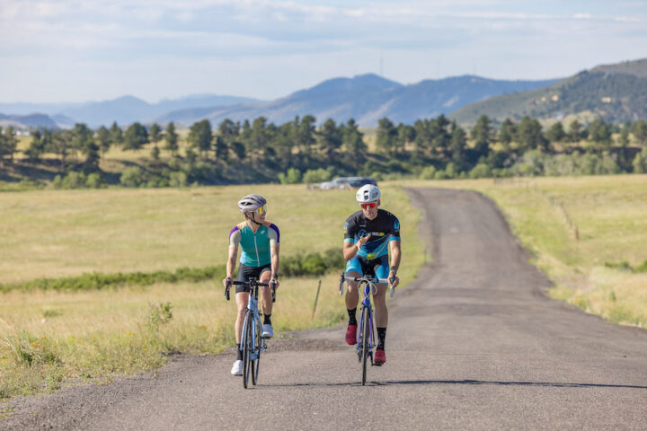 Coach and athlete on a training ride.