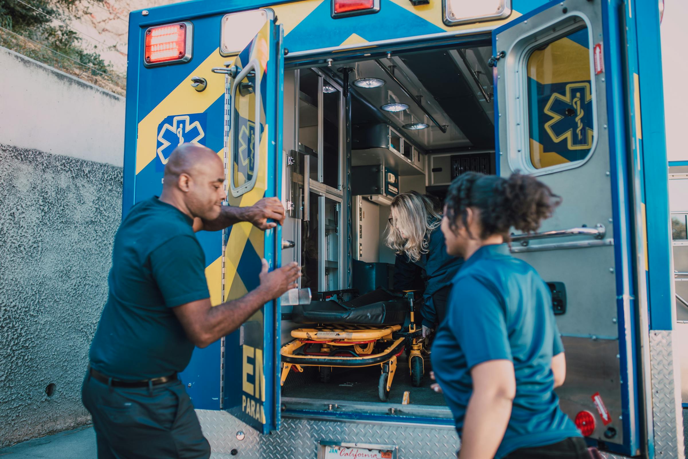 EMTs opening the doors of an ambulance
