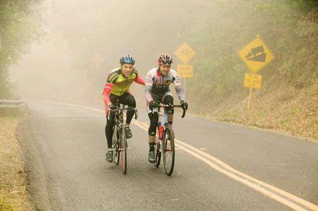Scott Saifer cycling with another athlete through fog