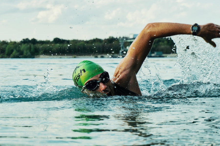 Triathlete swimming in a lake