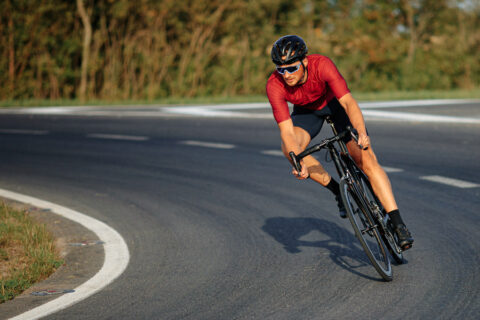 young man riding bike on the road