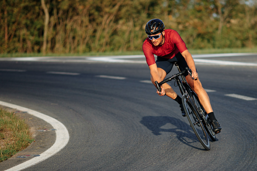 young man riding bike on the road