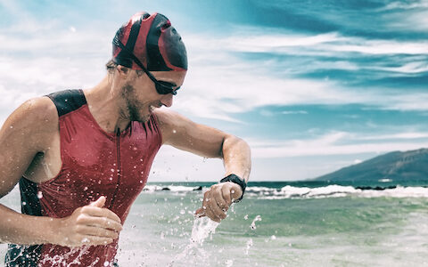 triathlete checking his watch