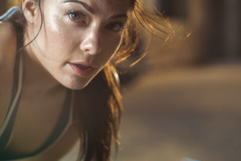 young woman looks at camera after workout