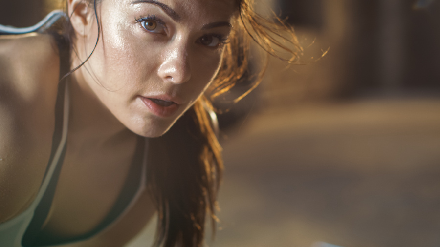young woman looks at camera after workout