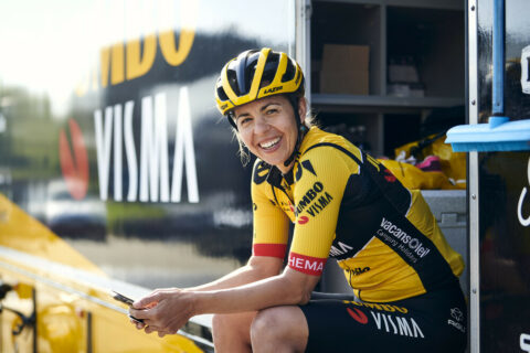 Carmen Small sitting on side of van in biking gear