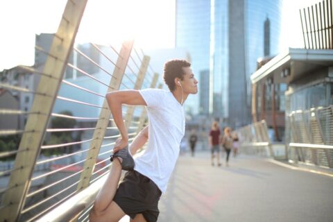 man stretching for run