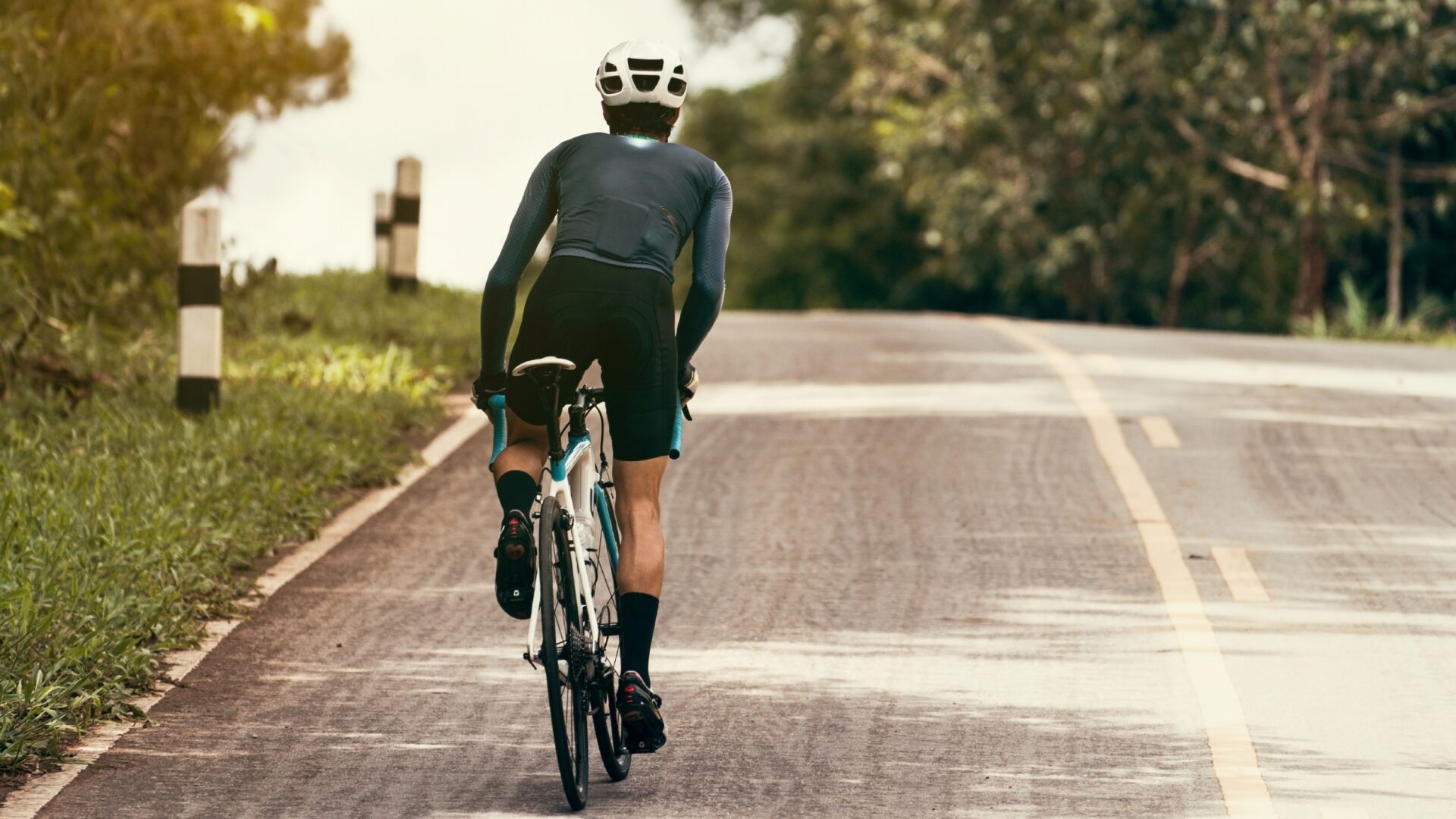 Cyclist powering up a hill