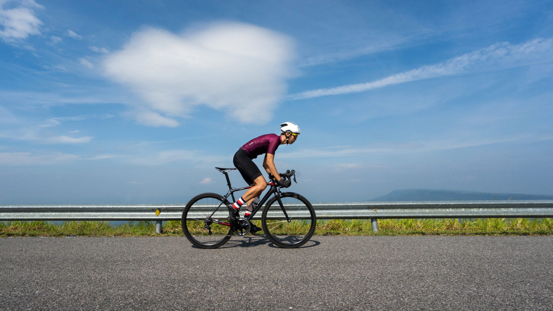 Road cyclist on a plateau, doing icing on the cake over-unders