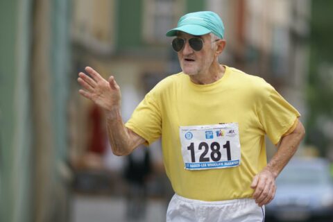 Older man running in a race