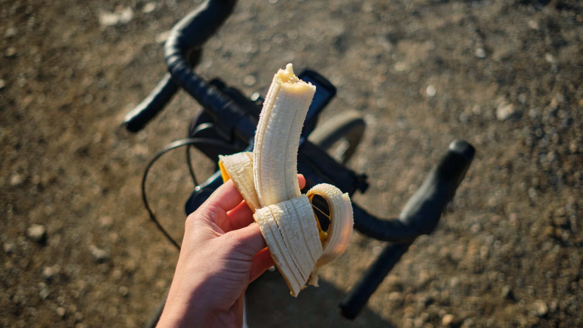 First-person POV eating a banana on a bike ride