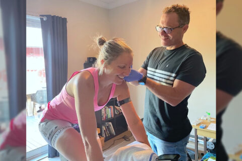 Bevan McKinnon performing a lactate test on a female athlete