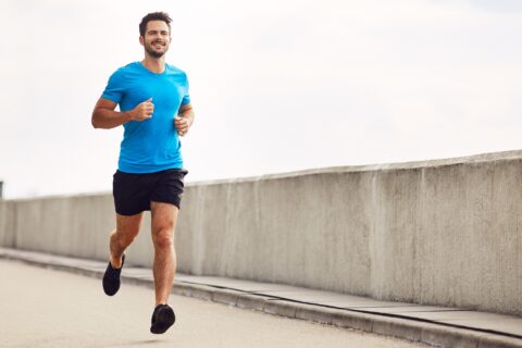 Man running along a bridge