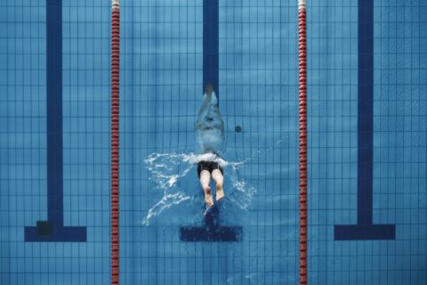 Man diving into a swimming lane