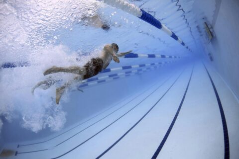 Someone swimming underwater.