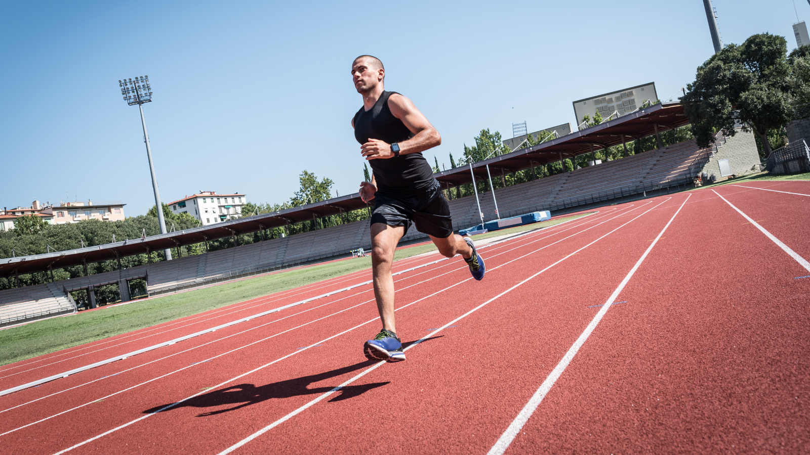 Man running micro-intervals on an outdoor track