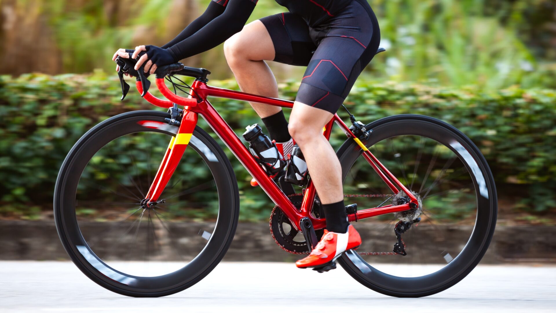 Lower section of a road cyclist riding their bike