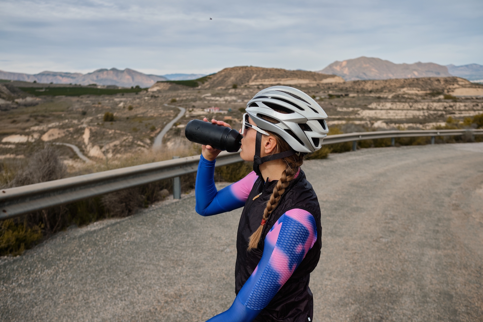 female rider stopping to take a drink