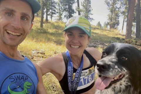 David and Megan Roche on a trail with their dog.