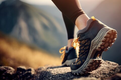 Closeup of an ultrarunner's shoe as they trek through the mountains