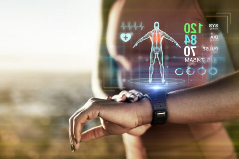 Close up of a female athlete looking at vital stats as a hologram on her fitness watch