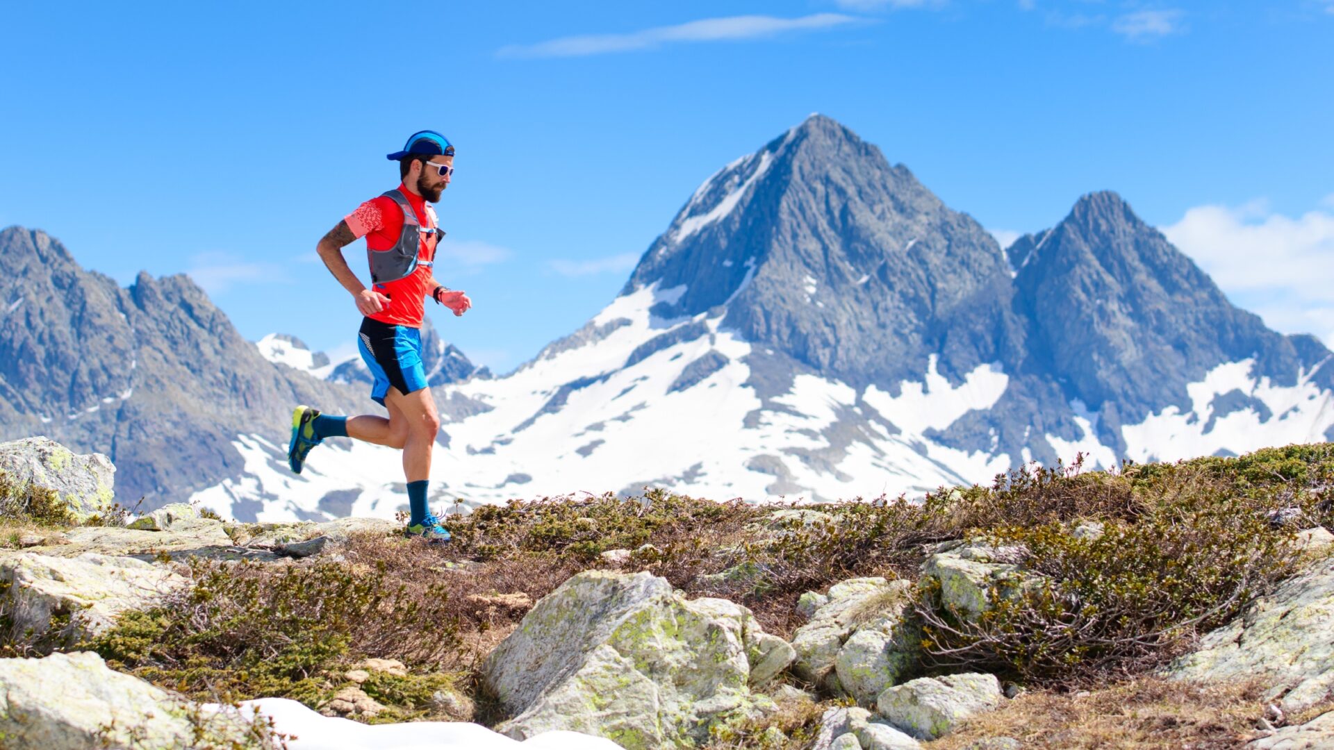 Man ultrarunning high in the mountains