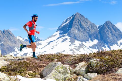 Man ultrarunning high in the mountains