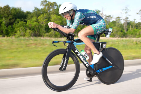 Masters triathlete Dede Griesbauer races on a triathlon bike during the Ironman Texas triathlon.