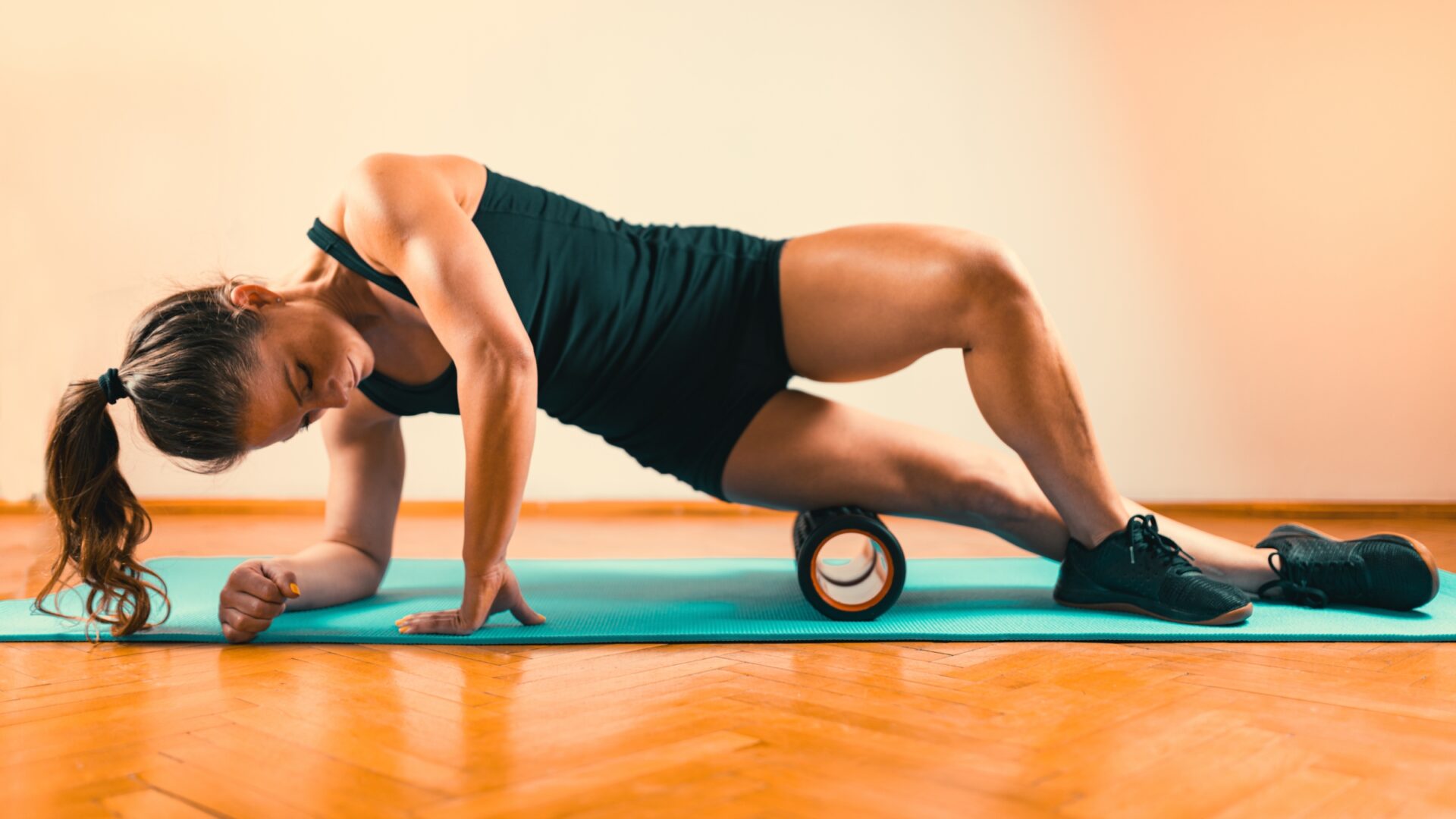 A woman foam rolling