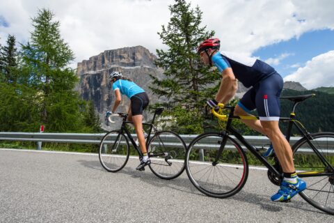 Two cyclists performing hill sprints around the Dolomites.